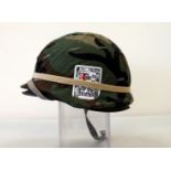 American army helmet "dollied up" to look like Vietnam era.
