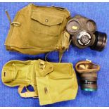 Modern NBC gas mask with carrying case. Another older mask.