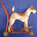 Push along plastic dog with foot rests, 55cm high.