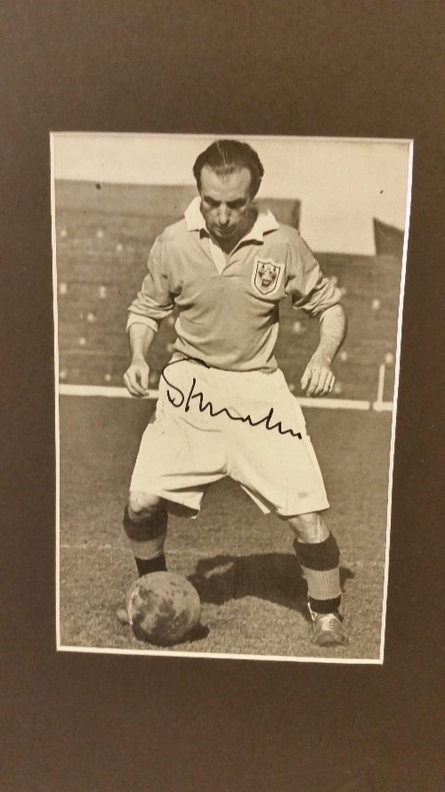 FOOTBALL, signed magazine photo by Stanley Matthews, full-length pose in Blackpool kit, overmounted,