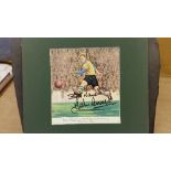 FOOTBALL, signed magazine photo by John Charles, in actioon for Leeds United, overmounted, 13.25 x