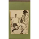 FOOTBALL, signed magazine photo by George Best, full-length in action for Northern Ireland,