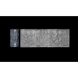 Cylinder Seal with Winged Deity and Symbols