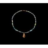 Roman Glass Necklace with Gold Isis Pendant