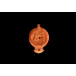 Roman Oil Lamp with Dancer and Pan with Pipes