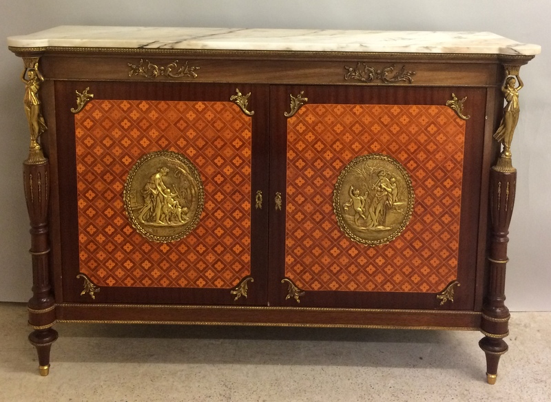 A French style Ormulu marble top side cupboard with gilt figures, two doors and on brass supports