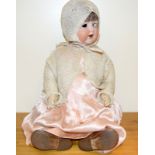 Large German china headed doll, marked Armand Marseille 992 A14M, in pink dress.