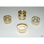 4 silver napkin rings of varios ages