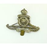 A silvered cap badge of the Royal Artillery Volunteers