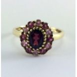 Almadine garnet and topax 9ct gold ring. Size R