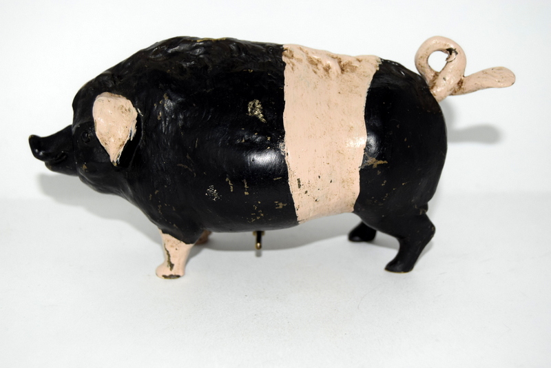 an unusual bronze saddleback pig in the form of a bell