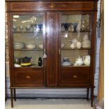 An Edwardian glass door display cabinet on tapered legs. 185 x 155 x 35cm