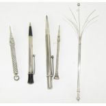 4 silver propelling pencils and a silver cocktail swizzle stick