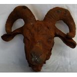 A large ram's head figure