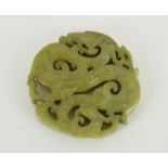 a green Chinese carved disc