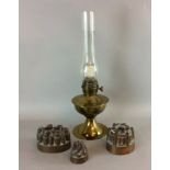 3 copper jelly moulds makers marks and a bass oil lamp and flue