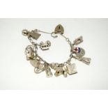 Silver charm bracelet with 14 charms