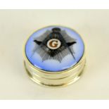 a round silver pill box with enamel Masonic image to the lid