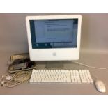 Apple Mac computer with key board and mouse with misc. accessories