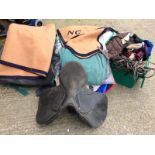 Large quantity of equestrian items to include saddle bridles cover etc. and two blankets from