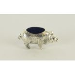 a silver pig pincushion