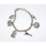 Silver charm bracelet and charms