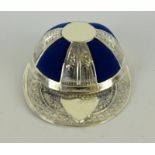 a silver pincushion in the shape of a baseball cap