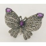 a silver marcasite and amethyst dress ring in the form of a butterfly