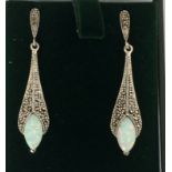 a pair of silver and marcasite earrings with opal panels in the art deco style