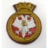 A hand painted metal ships crest mounted on a wooden shield to HMS Falmouth 15cms x 20cms