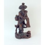 Carved wooden Oriental Figure 30cm tall