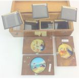 Hand painted magic lantern slides with a collection of Astro slides boxed