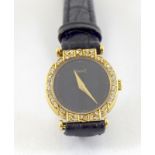 a ladies 18ct yellow gold piaget wristwatch with diamond bezel