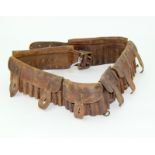An original Boer War & WW1 era leather bandolier to hold 50 cartridges. Marked in ink to reverse