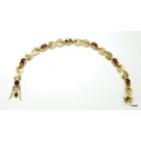 9ct gold ladies diamond and garnet line bracelet h/m