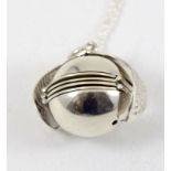 a silver picture locket in the form of a necklace