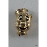 A 9ct gold charm in the shape of a pig with moving mouth 8 gm