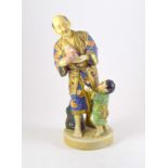 a Japanese ceramic figure of a man and a child holding a dove of peace