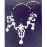 a pretty silver cz and opal set necklace in the art nouveau style