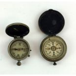 Two pocket watch cased compasses