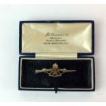 A HM silver and gold faced sweetheart rifle brooch to the Wiltshire Regiment 5.5cms x 2cms