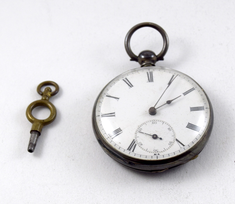 Silver pocket watch and key needs service and clean