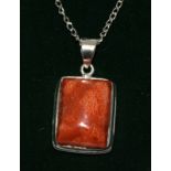 a silver and apple coral pendant necklace