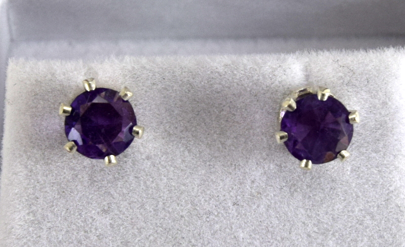 a pair of silver and amethyst stud earrings