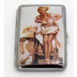 a cigarette case with enamel panel to the front depicting a young lady
