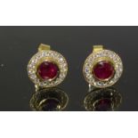 a pair of 18ct yellow gold ruby and diamond earrings 1.5cts