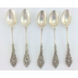 5 silver teaspoons. hallmarked London 1909 by Williams Comyns 7 Sons. 11.5cm in length, total weight