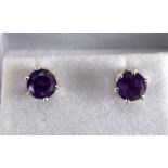 a pair of silver and amethyst stud earrings