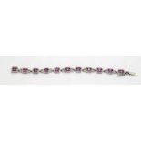 an impressive 18ct white gold pink sapphire and diamond bracelet set with 1.6ct's of diamonds and