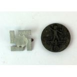 A Third Reich 1937 Labour Day badge 3.5cms diameter and a 1933 Lippe swastika badge 2.5cms square